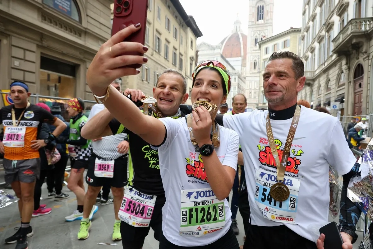 Volti soddisfatti dopo la Maratona di Firenze
