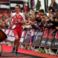 BRINGING THEM HOME: Alistair Brownlee of Great Britain runs down the finishing chute with a large crowd cheering on as he earned second place at the 2018 Isuzu IRONMAN 70.3 World Championship (Photo by Donald Miralle/Getty Images for IRONMAN)